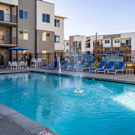 Sparkling swimming pool with lounge seating Sparkling swimming pool with lounge seating