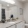 Bathroom with large vanity and ample lighting