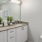 Bathroom with double vanity and ample lighting